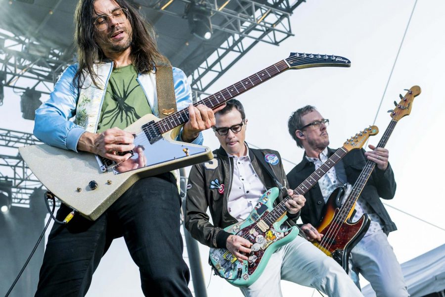 From left to right: Brian Bell, Rivers Cuomo and Scott Shriner Rock out at a show. Drummer Pat Wilson is not featured.