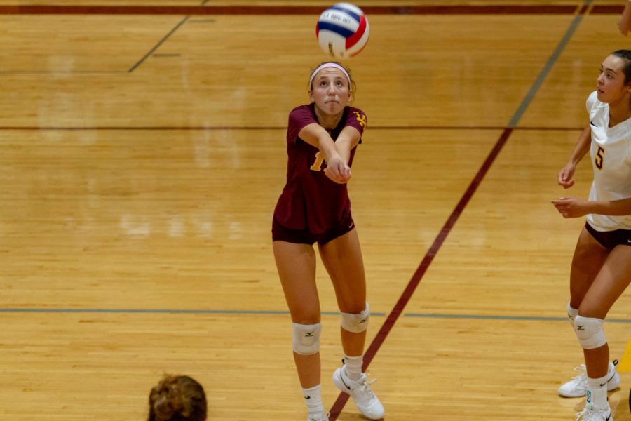 Grace Anello going for the ball. She is the libero for the girls varisty team.