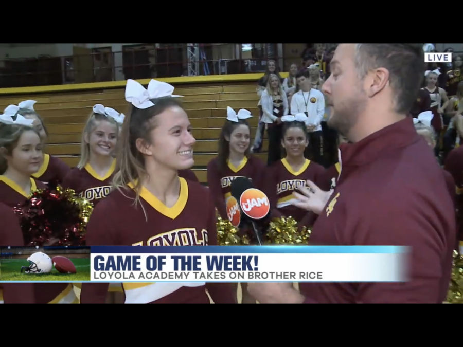 JamTV+anchor+Jon+Hansen+interviews+Senior+cheer+captain+Olivia+Norton.+