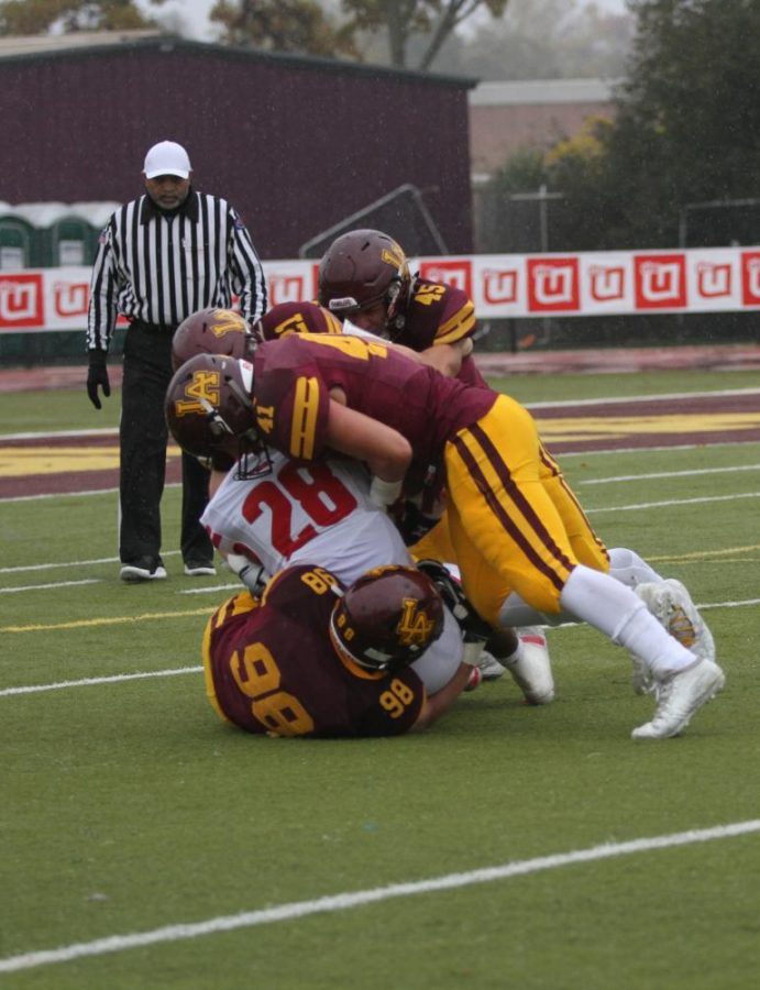 The Loyola defense swarms the Marist offense in the 6-14 loss. They look to bounce back in the first round of the playoffs against Maine South. 