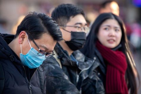 Many Chinese citizens wear surgical masks to prevent the virus from spreading too easily.