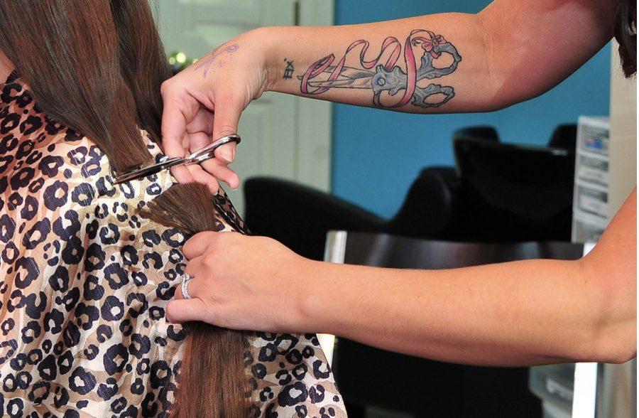 Donor gets hair cut for Wigs For Kids. All donations have helped children for thirty years. 