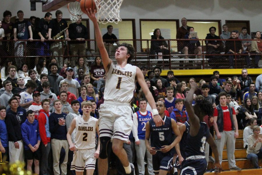 Senior Matty Enghauser shoots an easy lay-up against DePaul. Matty and his teammates rolled into the playoffs as the number one seed. 