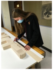 Members of ALAC work on a model of the entire school to help envision the design of a new quad. 