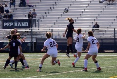 Loyola players defend as a New Trier player goes up for a header. The teams would go on to tie the game 1-1.