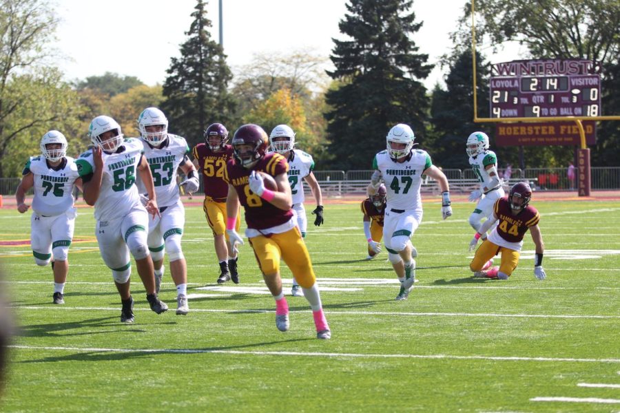 Corey Larson rushes past the Providence defense. The Ramblers would go on to shut out the Celtics 40-0. 