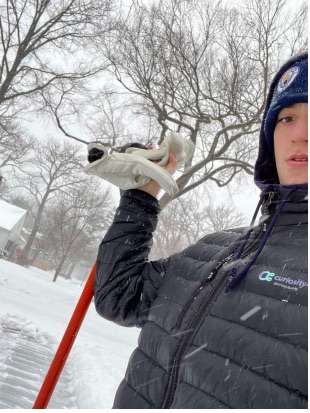 Junior Joey Vehovsky shovels his neighbors driveway for his extra credit assignment in
his political science class.