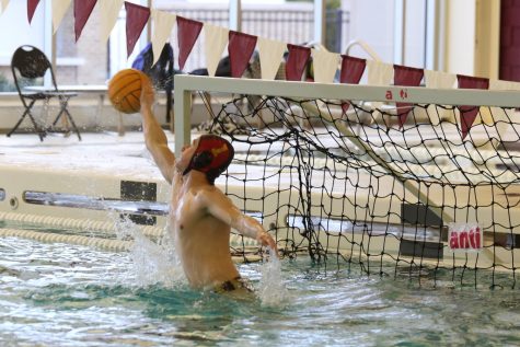 Goalie Jonas Brock stretches out for the save. His standout performance against Brother Rice helped the team to victory. 