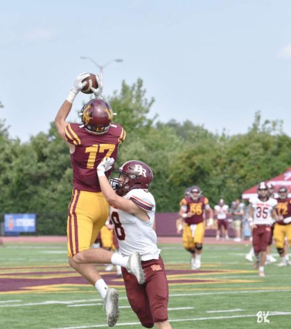 Forde brings down his first of three touchdowns against Brother Rice. The Ramblers won 57-21.