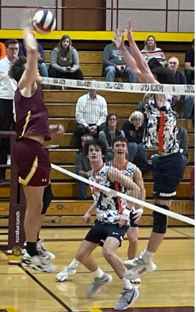 Senior Jake Balata goes up for the kill against the Husky blockers.  Balata would go on to score five kills in the win against OFRP.