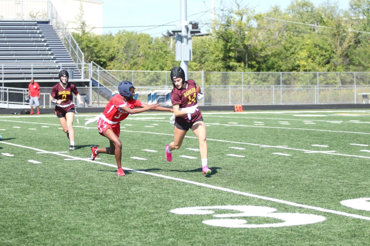 The Loyola run game tries to turn the corner during an earlier game against North Chicago. 