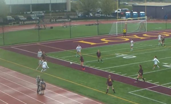 Rain go away, the Ramblers grab the ball from a throw-in and turn toward the net for a shot. Loyola played a strong game but couldn’t get a goal. 