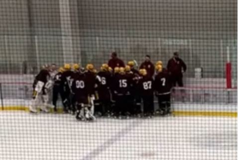 Loyola huddles during the first intermission to talk over the game so far.