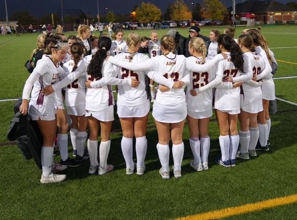 Together as a team, Loyola Field Hockey gathers for a huddle. They have had a great season and hope to play well in their upcoming games. 