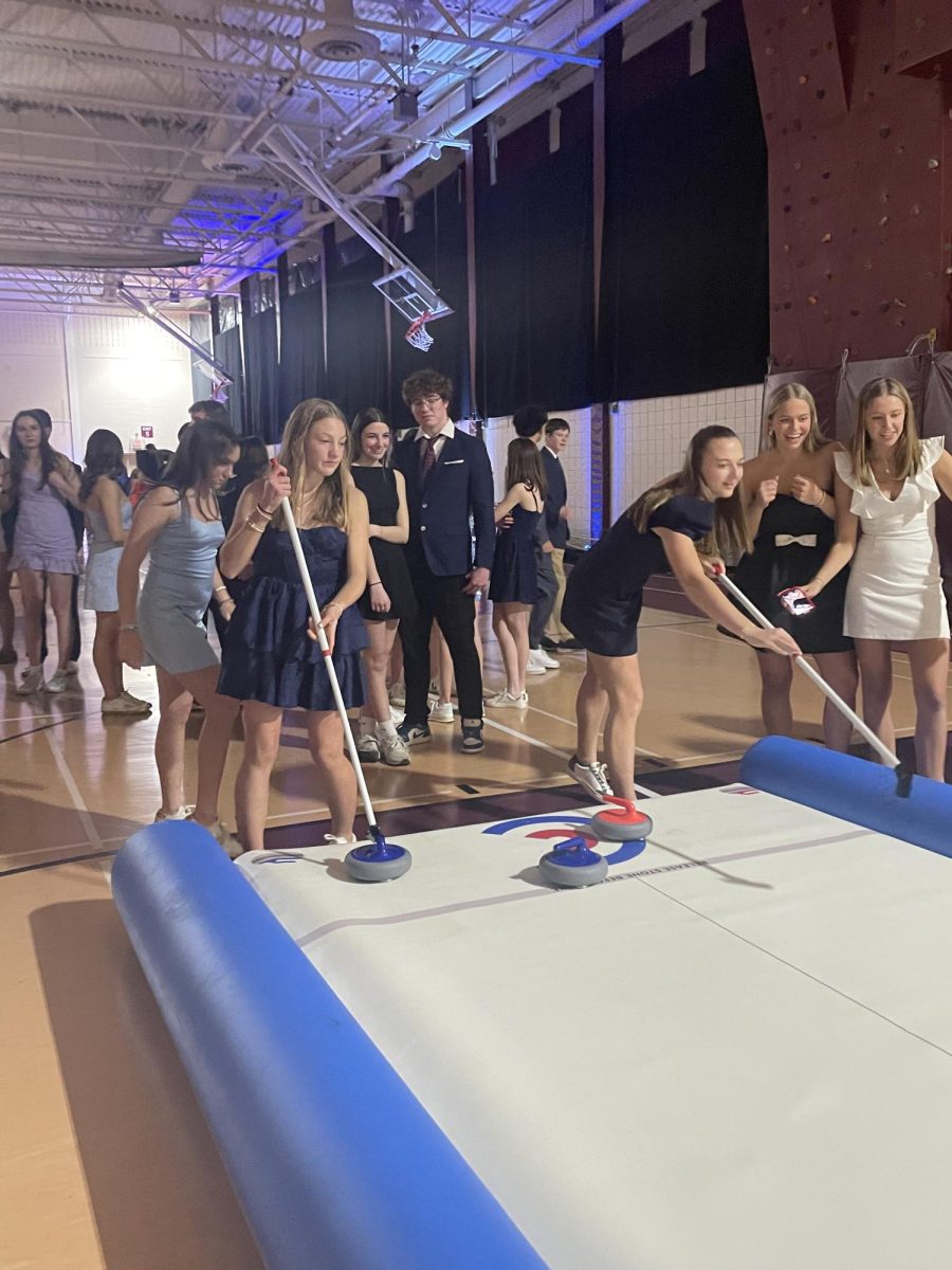 Snowcoming offered more than just dancing. Students could also play games like curling with their friends. 