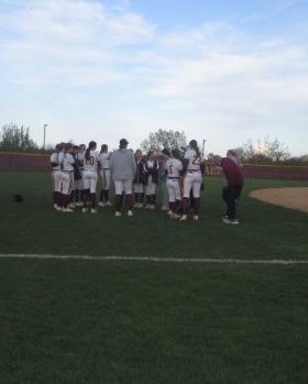 The Ramblers meet for their team huddle at the end of their game against Providence Catholic. 